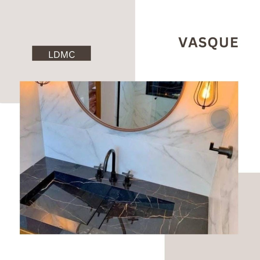 Black marble vanity with wall cladding by LDMC